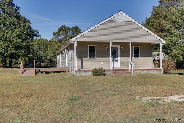 bungalow-style home with a front lawn