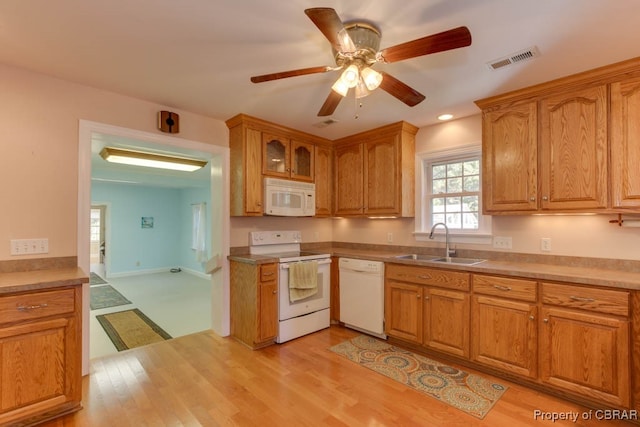 kitchen with sink, light hardwood / wood-style floors, white appliances, and ceiling fan