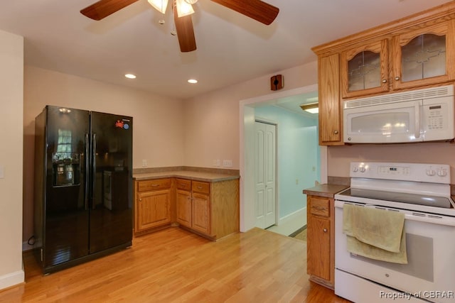 kitchen with white appliances, light hardwood / wood-style floors, and ceiling fan