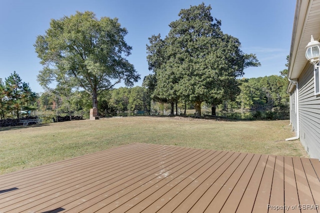 wooden deck with a yard