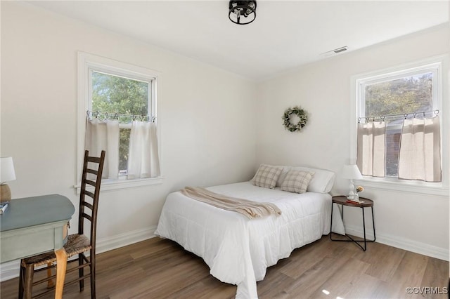 bedroom with wood-type flooring