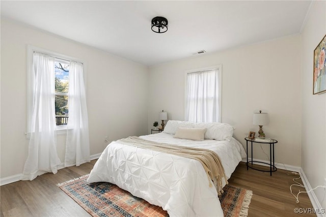 bedroom with wood-type flooring