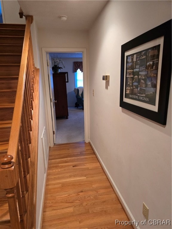 corridor featuring light wood-type flooring