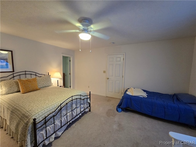 bedroom featuring light carpet and ceiling fan