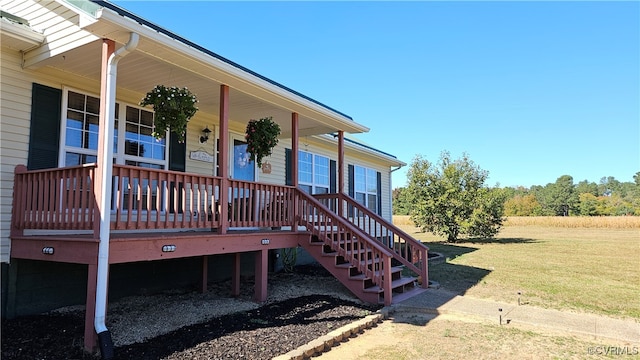 entrance to property with a yard