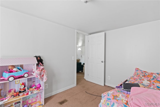 bedroom featuring light carpet