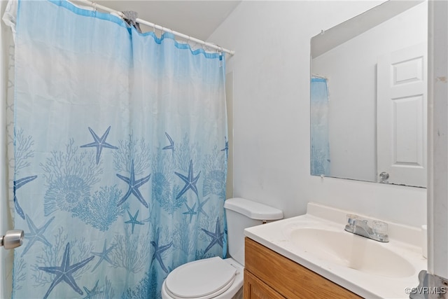 bathroom with a shower with curtain, vanity, and toilet