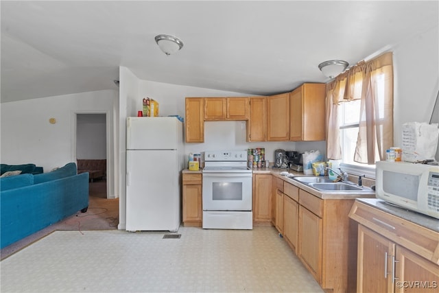 kitchen featuring white appliances, lofted ceiling, and sink