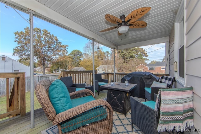 deck with ceiling fan, a grill, and an outdoor hangout area