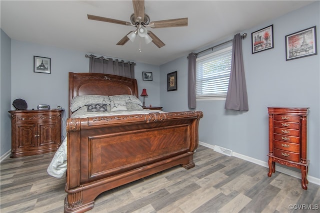 bedroom featuring hardwood / wood-style floors and ceiling fan