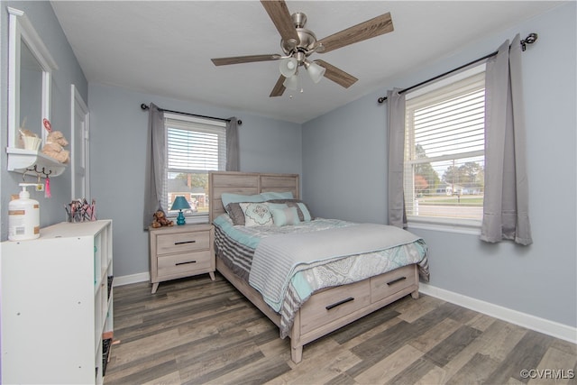 bedroom with dark wood-type flooring and ceiling fan