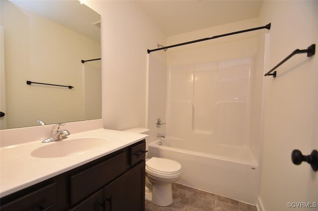 bathroom featuring vanity, shower / tub combination, and toilet