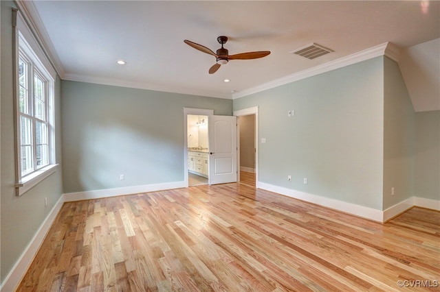 unfurnished bedroom with ensuite bath, crown molding, light wood-type flooring, and ceiling fan