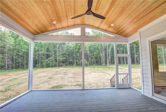 unfurnished sunroom with wood ceiling, ceiling fan, and vaulted ceiling