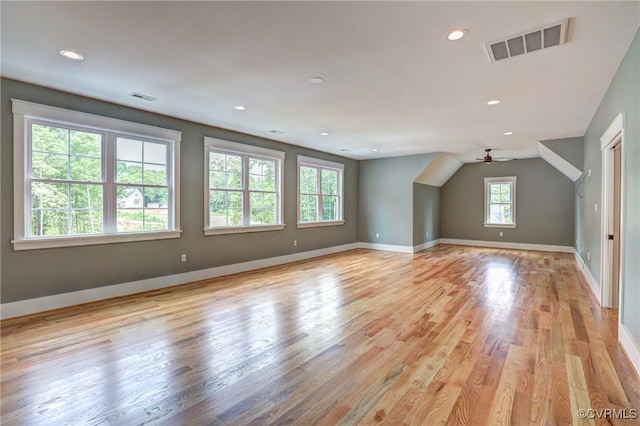 bonus room with ceiling fan and light wood-type flooring