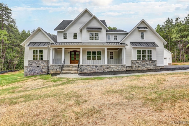 view of front facade with covered porch and a front lawn