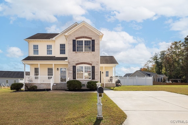 view of front of property with a porch and a front lawn