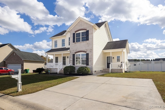 view of front of house with covered porch, a garage, and a front lawn