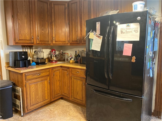 kitchen featuring black fridge