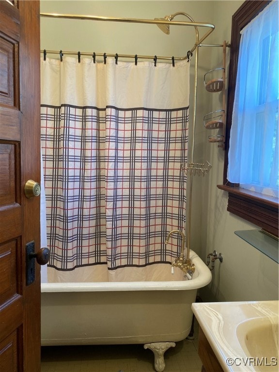 bathroom with shower / bath combination with curtain and vanity