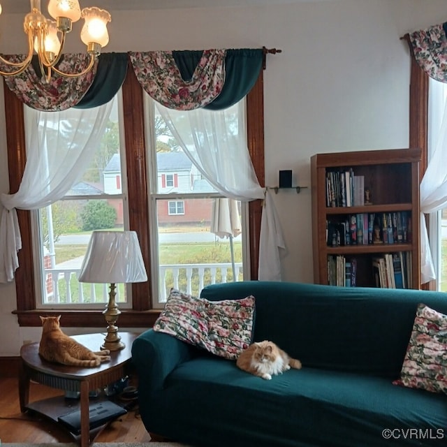 living area featuring a chandelier
