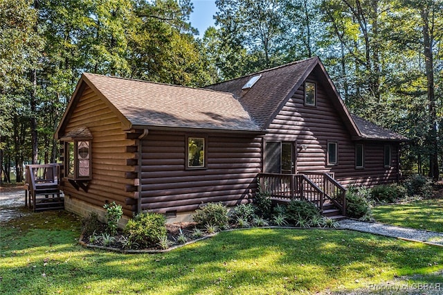 log-style house with a front yard and a deck