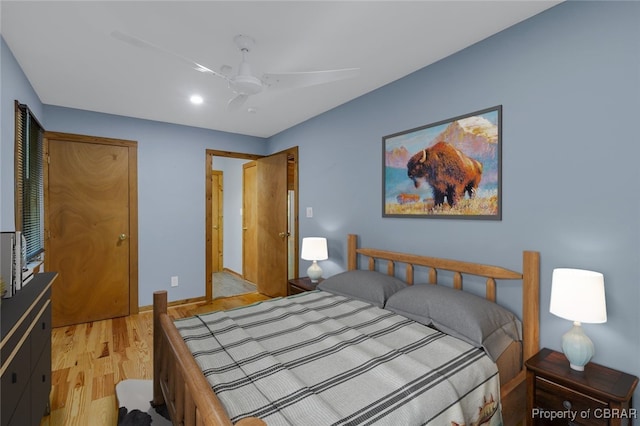 bedroom with ceiling fan and light hardwood / wood-style flooring