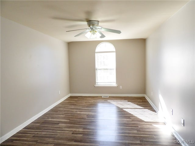 unfurnished room featuring dark hardwood / wood-style floors and ceiling fan