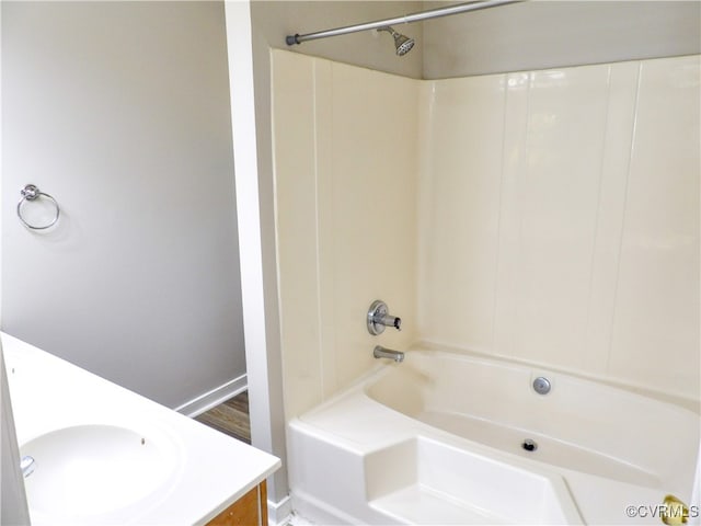 bathroom with vanity, hardwood / wood-style flooring, and tub / shower combination