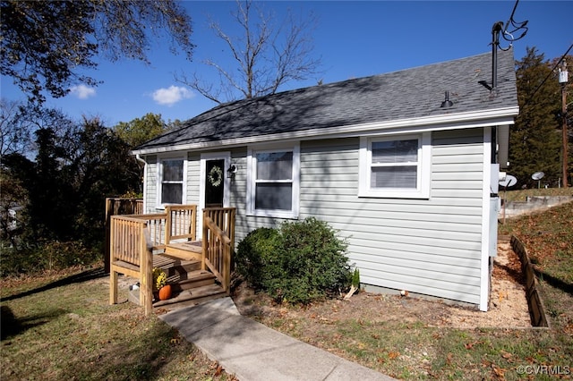 bungalow featuring a wooden deck