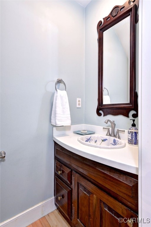 bathroom featuring hardwood / wood-style floors and vanity