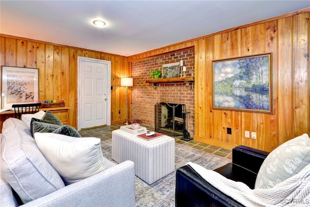 living room with wood walls and a fireplace