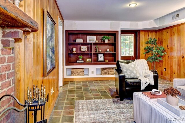 sitting room with wood walls