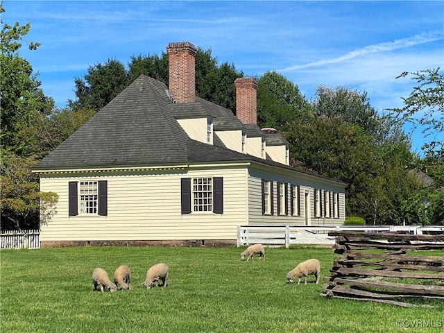 view of side of property featuring a yard