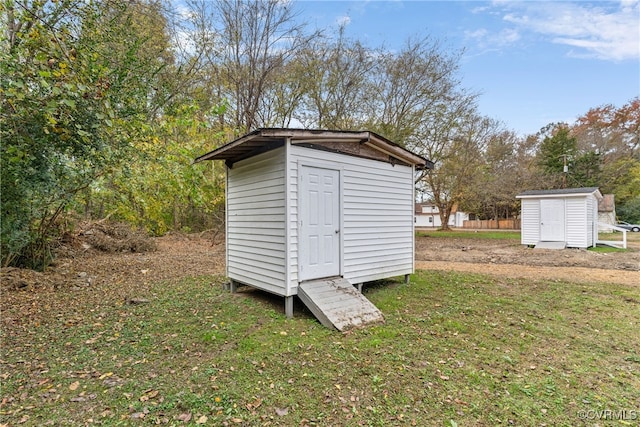 view of outdoor structure with a lawn