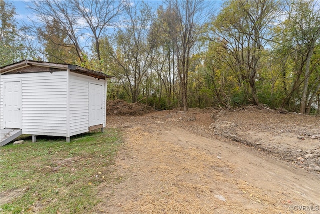 exterior space with a shed