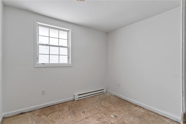 unfurnished room with a baseboard radiator