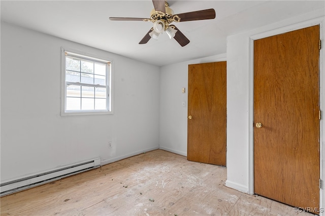 empty room with light wood-type flooring, a baseboard radiator, ceiling fan, and lofted ceiling