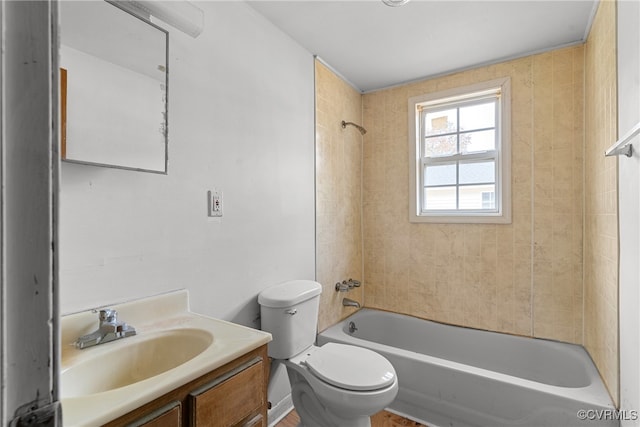 full bathroom featuring vanity, toilet, and tiled shower / bath