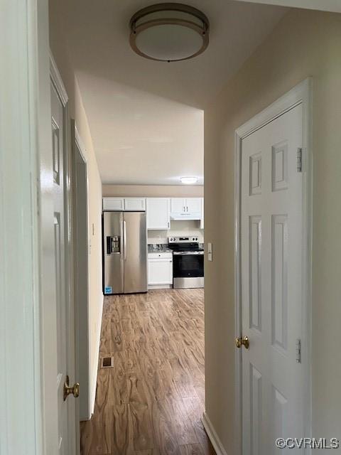 hall featuring light wood-type flooring