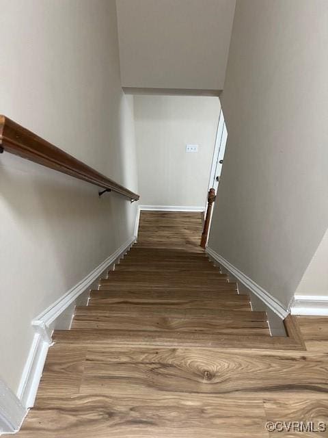 staircase featuring hardwood / wood-style flooring