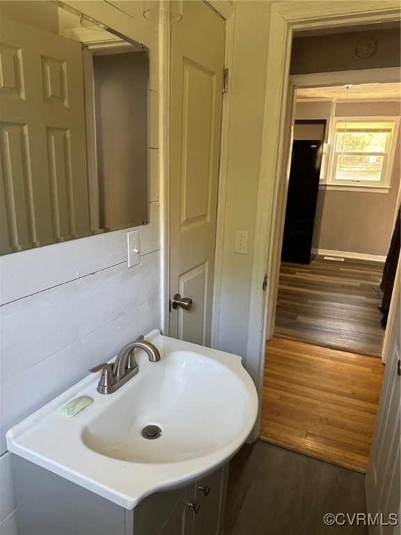 bathroom with vanity and hardwood / wood-style flooring