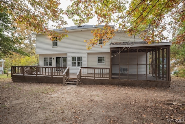 back of house featuring a sunroom and a deck