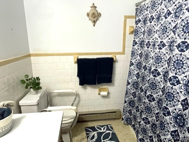 bathroom featuring toilet, tile walls, a baseboard radiator, and tile patterned flooring