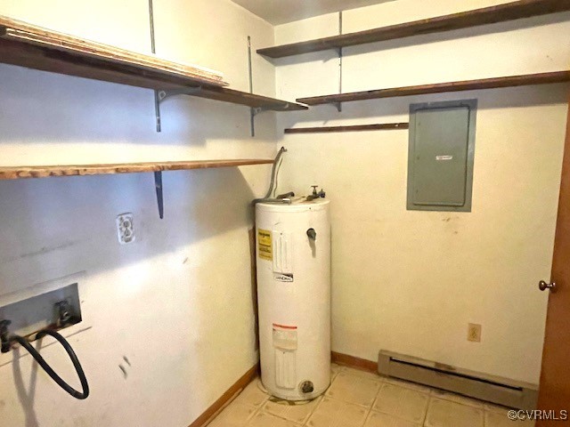 utility room featuring electric panel, electric water heater, and a baseboard heating unit