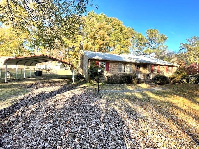 view of front of property featuring a carport