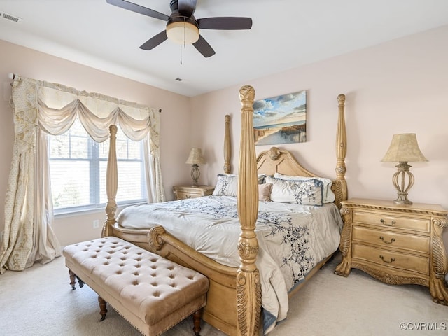 bedroom with light carpet and ceiling fan