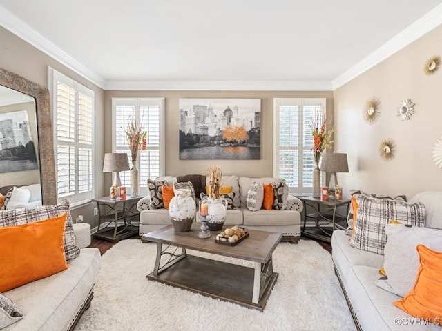 living room with hardwood / wood-style flooring, plenty of natural light, and crown molding