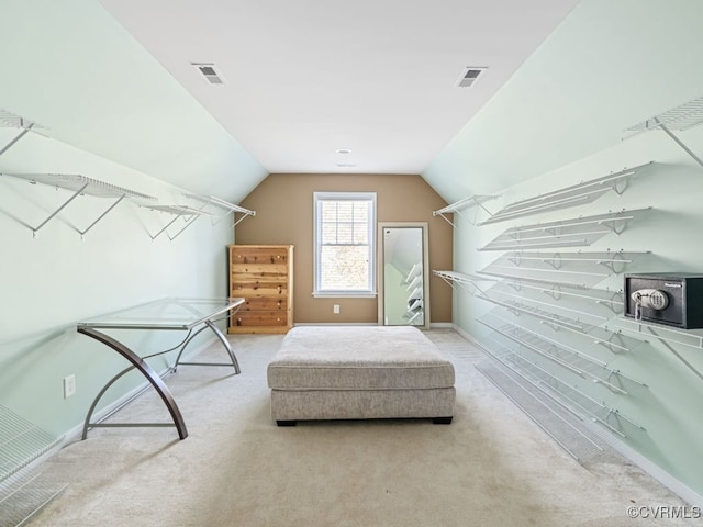 walk in closet featuring carpet and lofted ceiling