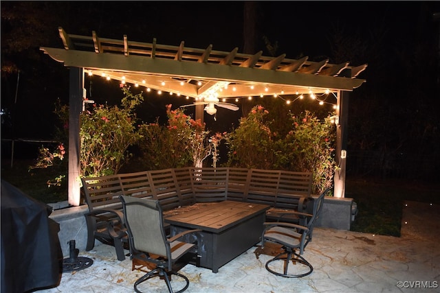 patio at twilight with a pergola, ceiling fan, and grilling area